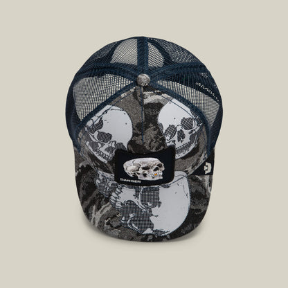 Goorin Bros. “Bone Head Danger” hat: a blue mesh-back cap featuring bold skull graphics and a front patch embroidered with a skull and the word “DANGER,” shown against a plain background.