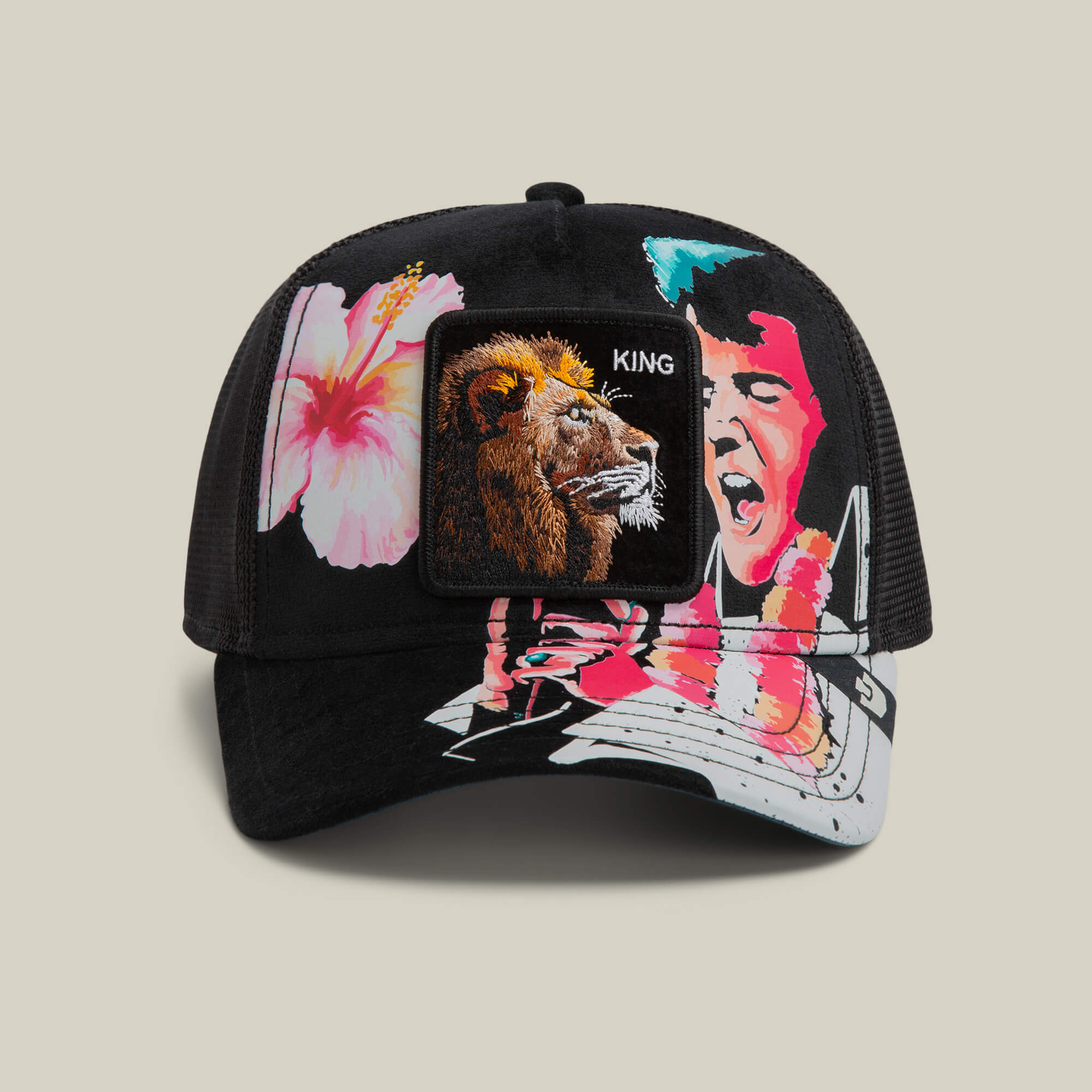 The Goorin Bros. Uh Huh King cap in VOID features a lion KING patch, pink hibiscus flower, and singing man with lei. Topped off with a blue suede underbrim for extra style—Aloha from San Francisco!.