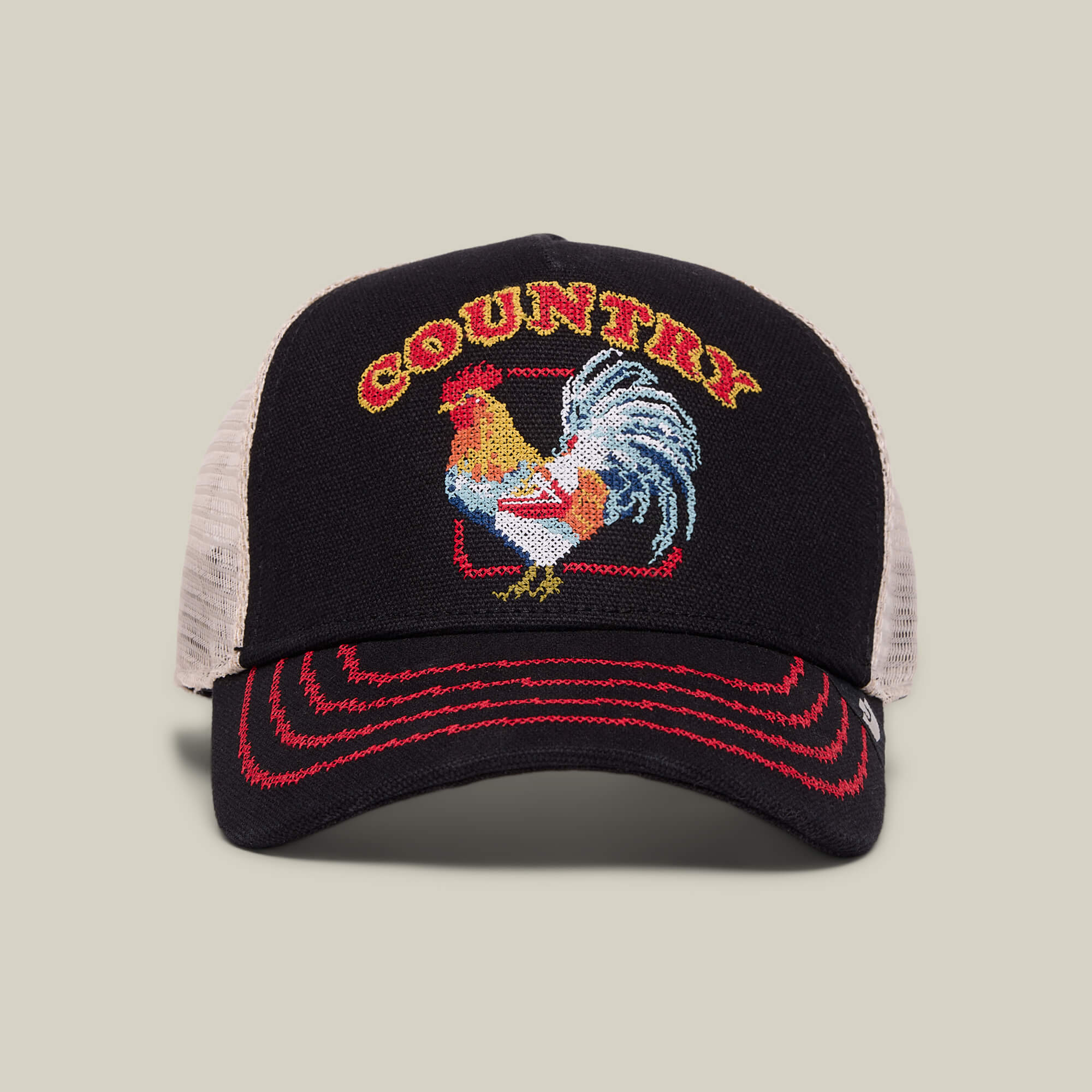 The Goorin Bros. "Middle of No Where" trucker hat in VOID features red stitching, an embroidered rooster, and COUNTRY in yellow—ideal for those who love home cookin' or crave fried chicken off the beaten path.