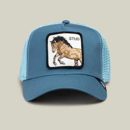 The Goorin Bros. Dad and Pony Show blue mesh trucker hat features a front patch with an embroidered horse and "STUD" in black. This limited edition is ideal for Father’s Day or matching dad and kid caps.