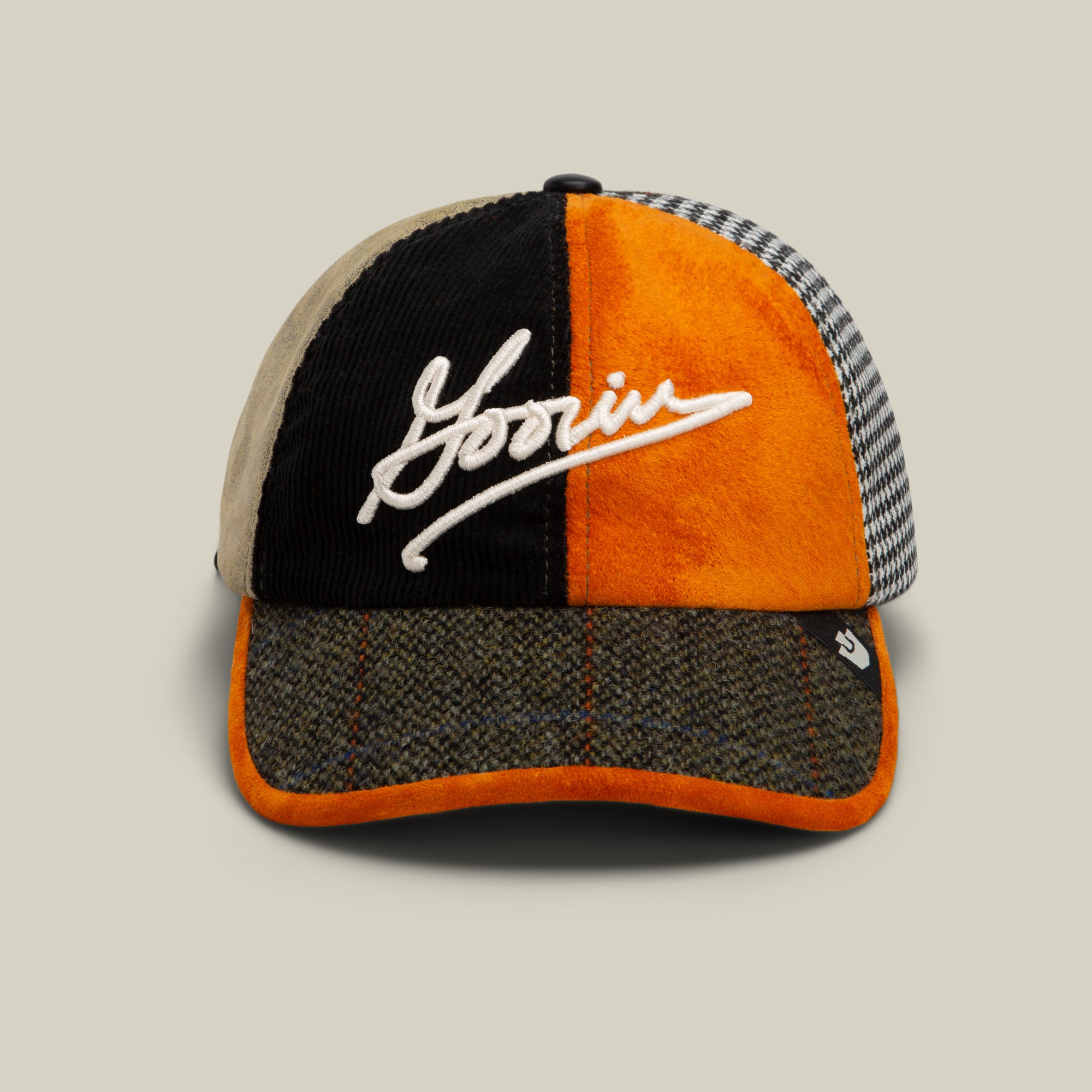 The "South Bay" Papa by Goorin Bros. is an amber statement hat with orange, black, beige, and houndstooth textured panels, featuring white Goorin Script on the front.