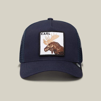 The Goorin Bros. Karlsson Moose is a navy trucker hat with a mesh back, featuring a front patch of a moose and "KARL" above it—a hockey-inspired cap for true fans.