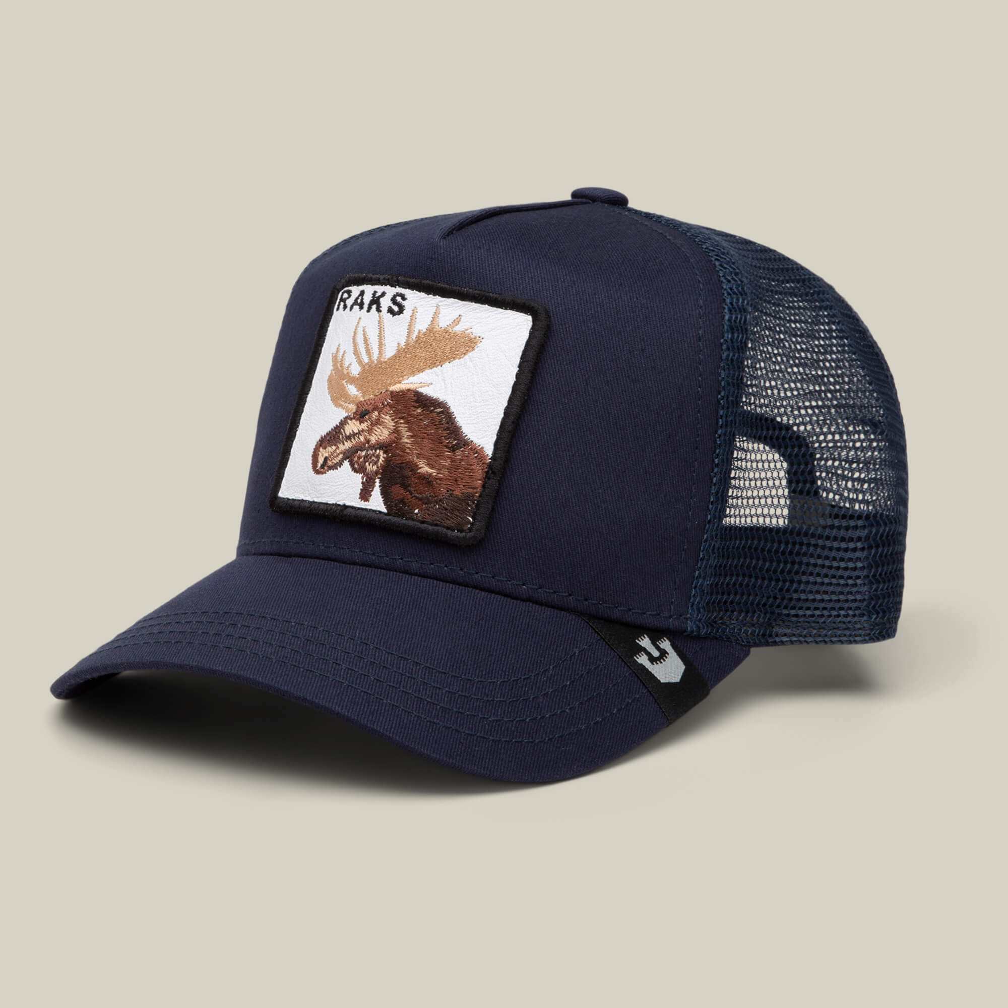 The Goorin Bros. Rakell Moose is a navy blue mesh trucker hat featuring a front patch with an embroidered moose and "RACKS"—a limited-edition cap ideal for Rickard Rakell fans.