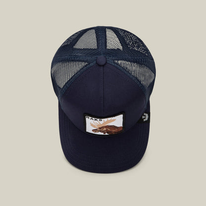 The Goorin Bros. Rakell Moose is a navy blue mesh trucker hat featuring a moose patch with "RACKS" on the front, photographed from above against a plain background—a perfect limited-edition cap for collectors.