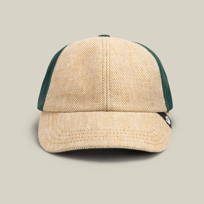 The Goorin Bros. Zig Zag Tailored Baseball cap in BEAM features a beige herringbone front and solid dark green textured side panels, shown from the front against a plain background.