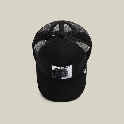 The Goorin Bros. Daddy Panther is a black mesh trucker hat with a front patch showing a platinum panther and the word "DADDY," displayed on a plain, light background.