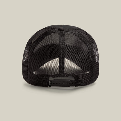 The Goorin Bros. Daddy King black mesh trucker hat is shown from the back, highlighting its adjustable snapback closure and "Daddy King" detail. This limited edition piece appears against a plain beige background.