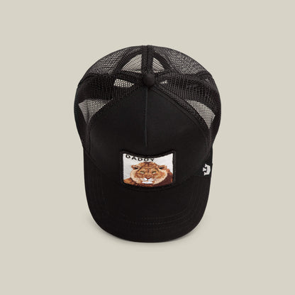 The Daddy King by Goorin Bros. is a black mesh trucker hat with a front patch featuring a lion face and "King Daddy" text. This limited edition accessory adds bold style to any outfit.