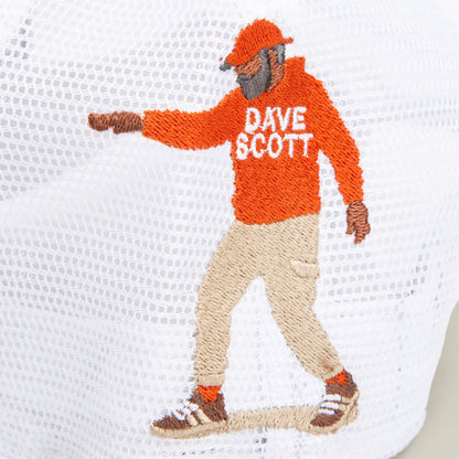 Depicted in a walking pose on white mesh, the embroidered figure wears a red hoodie labeled "Dave Scott," tan pants, and sneakers. Part of Goorin Bros.’ Dave Scott My Beautiful Lion collection.