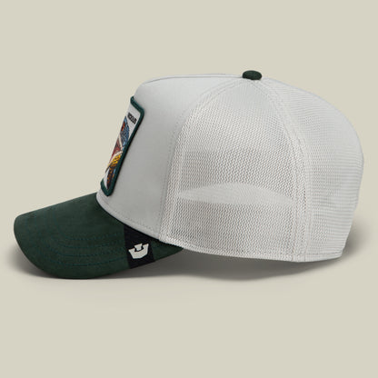 Side view of the Goorin Bros. Suede Snake trucker hat, showcasing a green suede brim, white mesh back, and a white front panel adorned with a colorful snake patch.