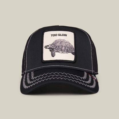 The Goorin Bros. Down Low... cap in Void Black features white stitching and a front patch with a tortoise and the words "TOO SLOW.