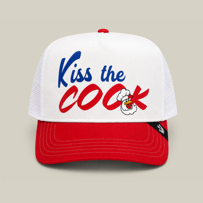 The Chef's Kiss trucker hat by Goorin Bros. in Dust/Rush features "Kiss the Cook" on the front with a cartoon OK hand—an ideal accessory for any backyard barbecue or aspiring grillmaster.