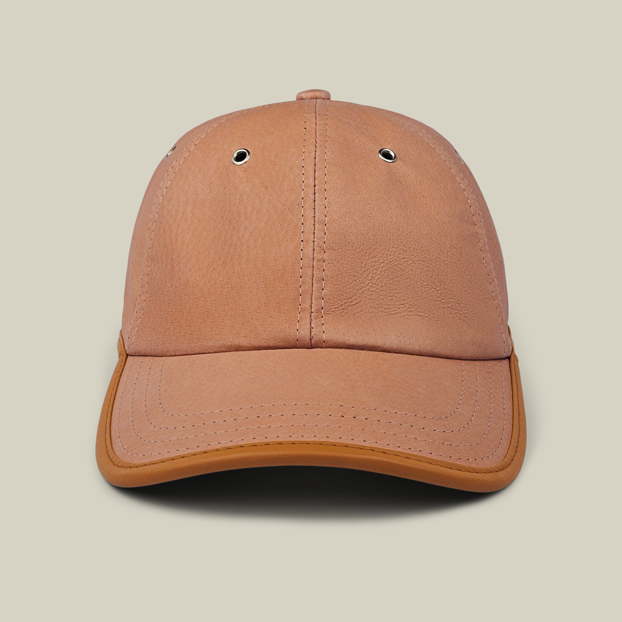 Steiner cap by Goorin Bros. in Tile Brown suede, with two metal eyelets on the front panels and an adjustable plaid strap at the back, shown from the front against a plain light background.