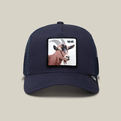 The Goorin Bros. 1845 Goat is a navy blue mesh trucker hat featuring a front rectangular patch with a goat's head and "1845" in black text.