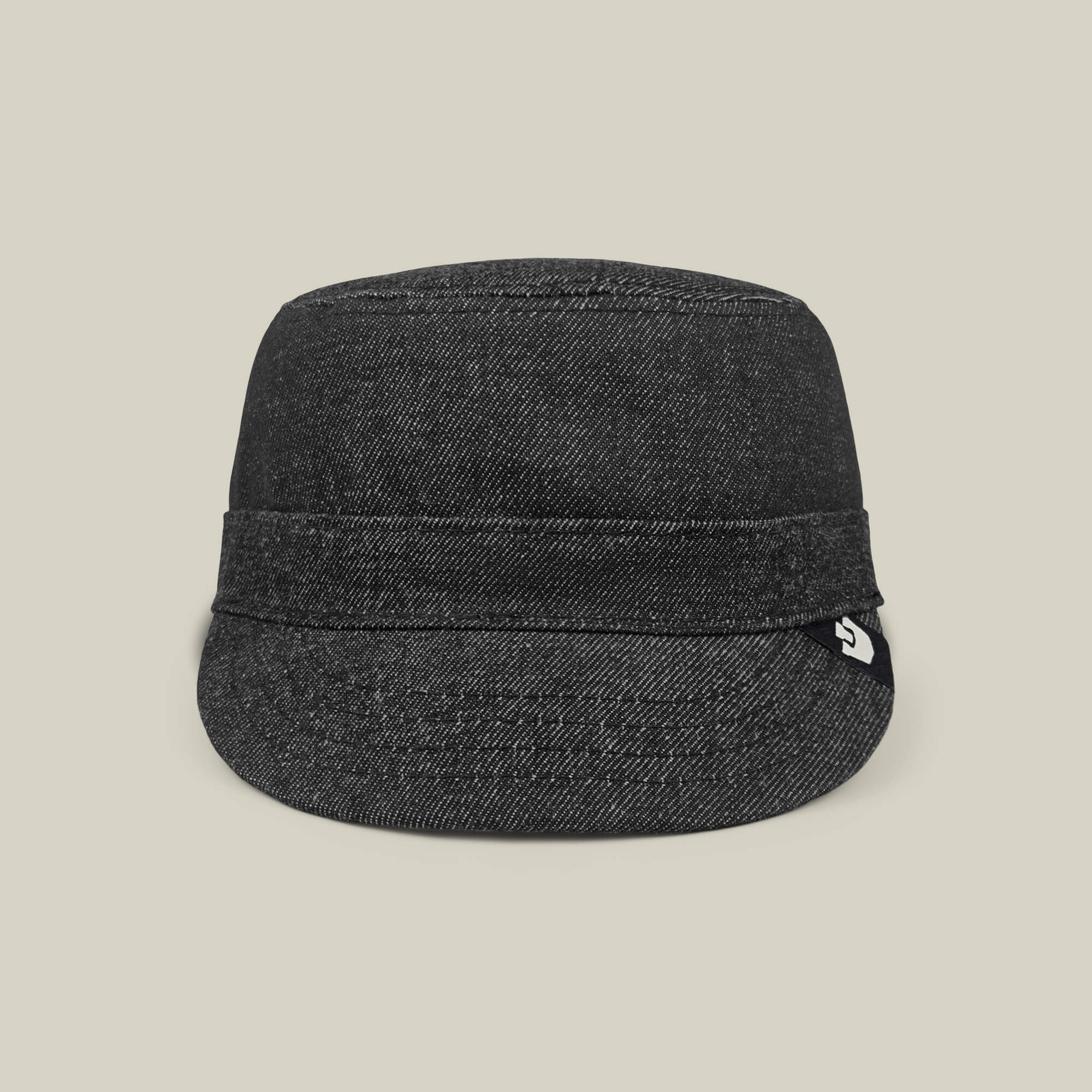 The Goorin Bros. Devonshire cap in black denim features a short brim and folded band, hand cut and sewn, displayed against a plain beige background.