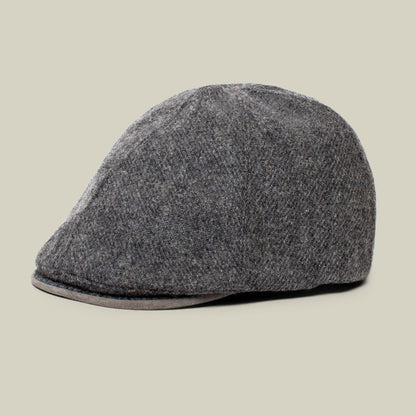 The Goorin Bros. “Ronald Amos” cap, featured here in charcoal, is a sophisticated six-panel hat with a two-inch brim, displayed against a plain beige background—making it the ideal choice for everyday wear and any occasion.