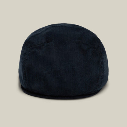 The Goorin Bros. Cozy Low Profile flat cap in EDGE is displayed front-facing against a plain beige background, showcasing its classic, versatile style for everyday wear.