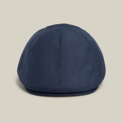 The Benjamin Paul by Goorin Bros. is a blue linen hat displayed on a white background, ideal for everyday wear and versatile enough for three seasons.
