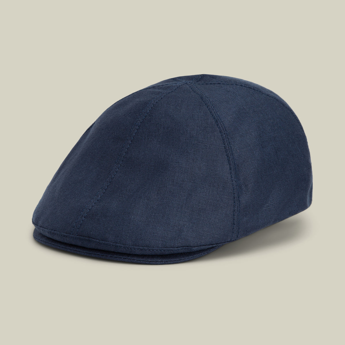 The Benjamin Paul flat cap by Goorin Bros., in a sleek dark navy fabric, is perfect as an everyday hat and is shown on a neutral background.