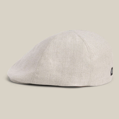 The Benjamin Paul by Goorin Bros. is a light beige linen hat with textured fabric, displayed from a side angle on a plain background—a versatile three-season choice for everyday wear.