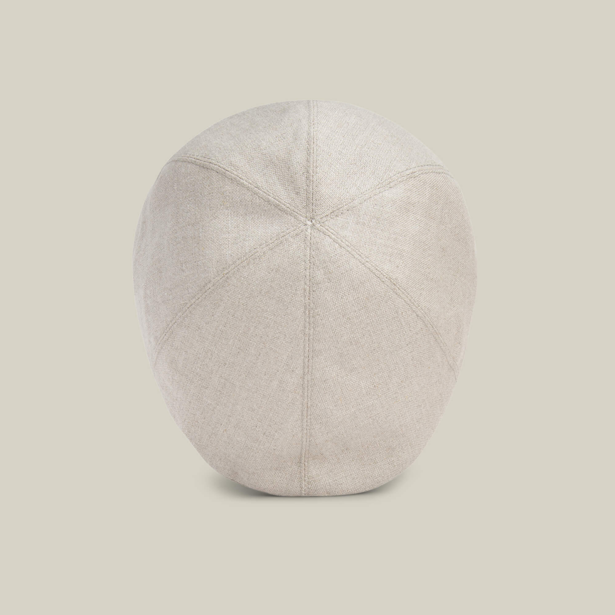 The Goorin Bros. Benjamin Paul hat, shown from the back against a plain background, highlights its stitched panels and rounded beige linen shape—an ideal choice for everyday wear.
