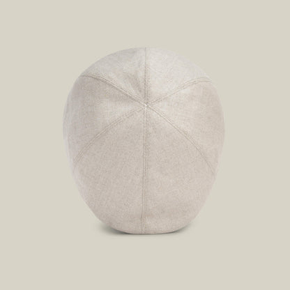 The Goorin Bros. Benjamin Paul hat, shown from the back against a plain background, highlights its stitched panels and rounded beige linen shape—an ideal choice for everyday wear.