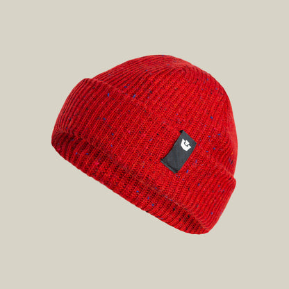 The Goorin Bros. No Comply is a warm red knit beanie with a folded brim and a black rectangular patch with a white logo, shown against a plain beige background.
