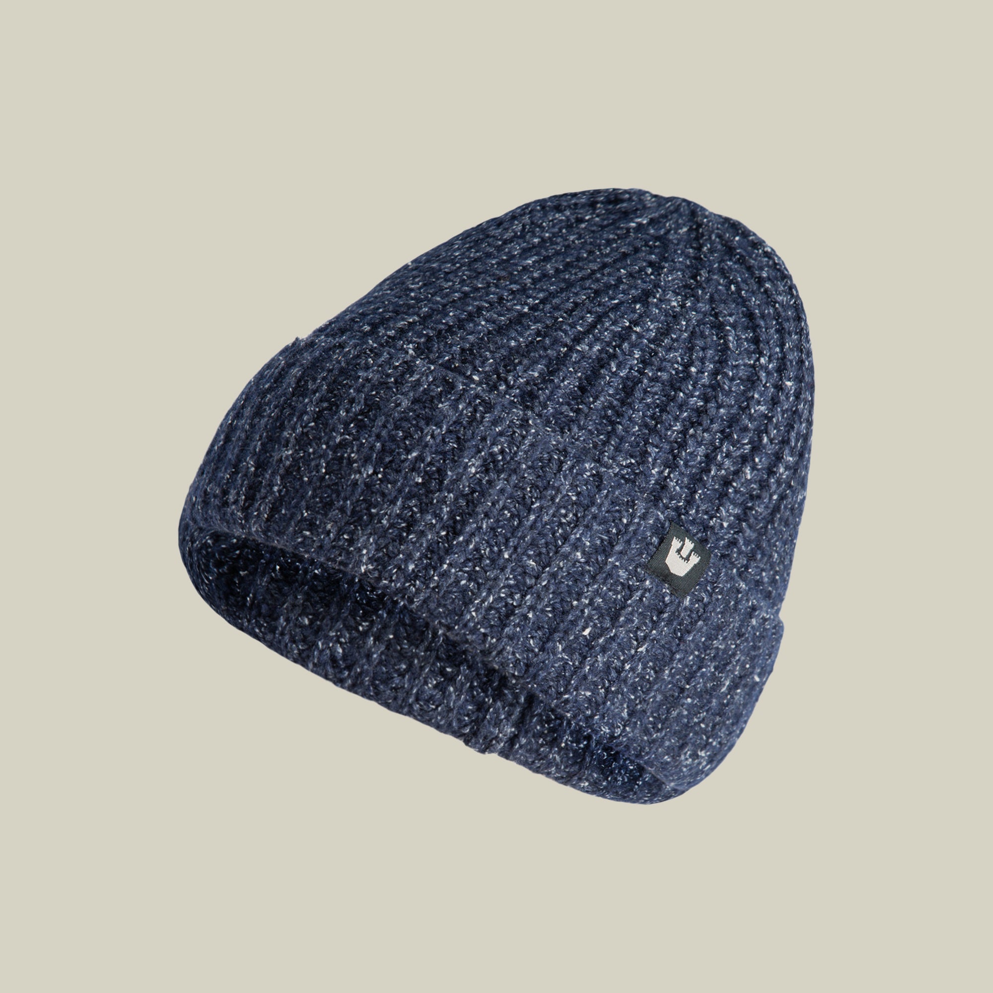 The Goorin Bros. Northstar beanie in navy features a ribbed texture and a small metallic logo tag on its folded brim, shown against a plain light background.