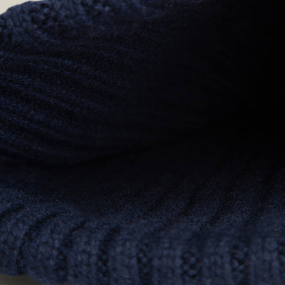 Close-up view of the dark blue ribbed knit fabric on the Dream Cap by Goorin Bros., showing its likely soft and luxurious interior.
