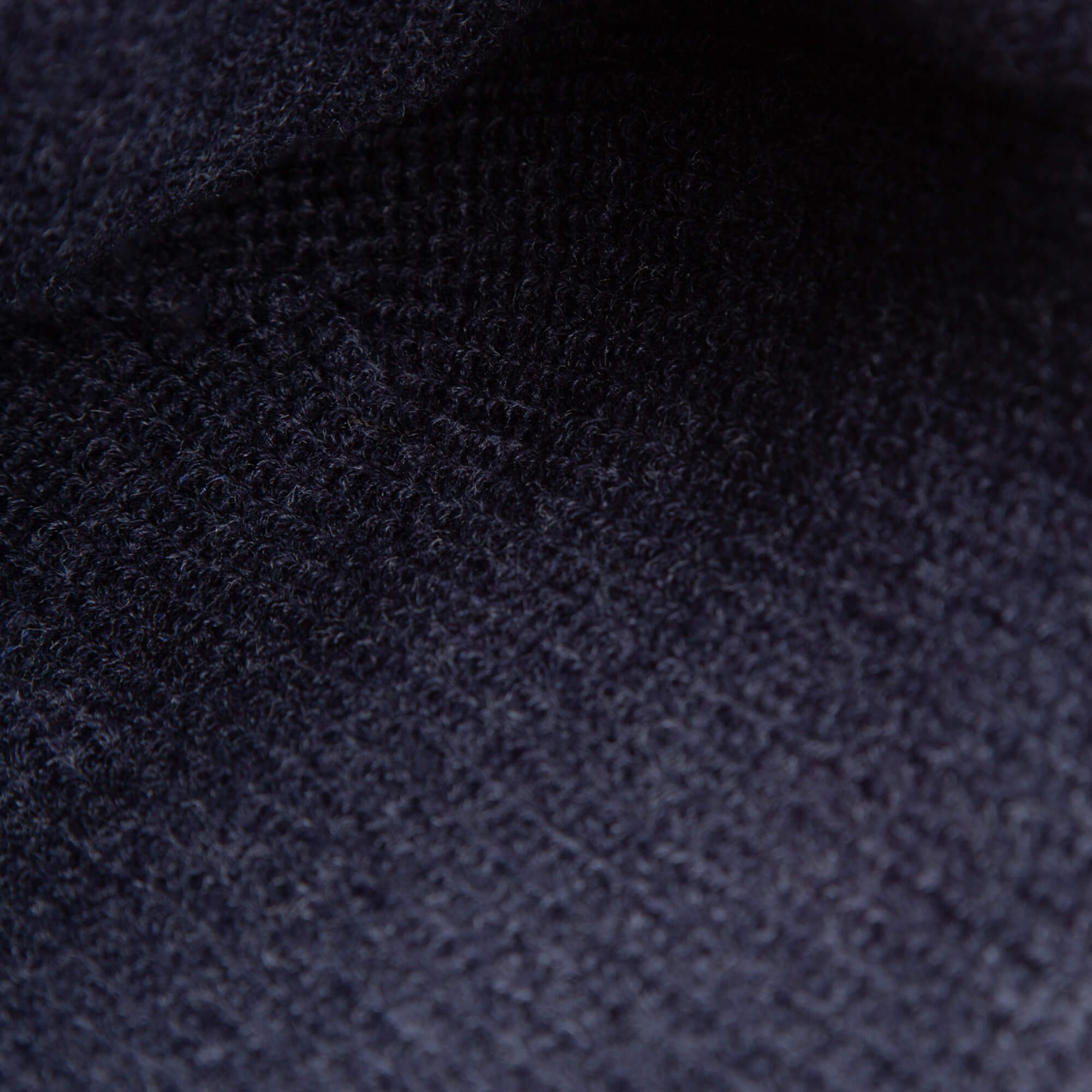 Close-up of The High Class Beanie by Goorin Bros.—a navy knit winter hat that showcases its detailed pattern and premium texture, ideal for those seeking luxury.