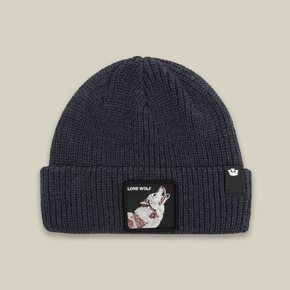 The Lone Wolf Beanie by Goorin Bros is a charcoal gray ribbed knit beanie featuring an embroidered wolf patch on the front with "Lone Wolf" text on a black label.