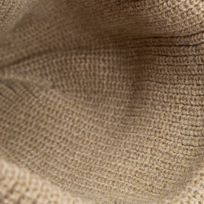 Close-up of the earth-tone knit, highlighting the detailed yarn texture of The Bandit Beanie by Goorin Bros.—ideal for a cozy winter hat.