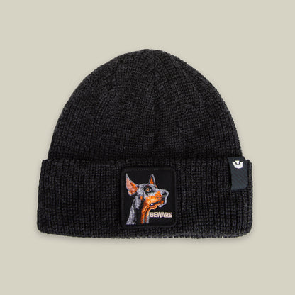 The Beware Dog Beanie by Goorin Bros. in VOID is a heavyweight knit beanie with a front cuff patch showing a dog's face and "BEWARE"—perfect for bold style and warmth.