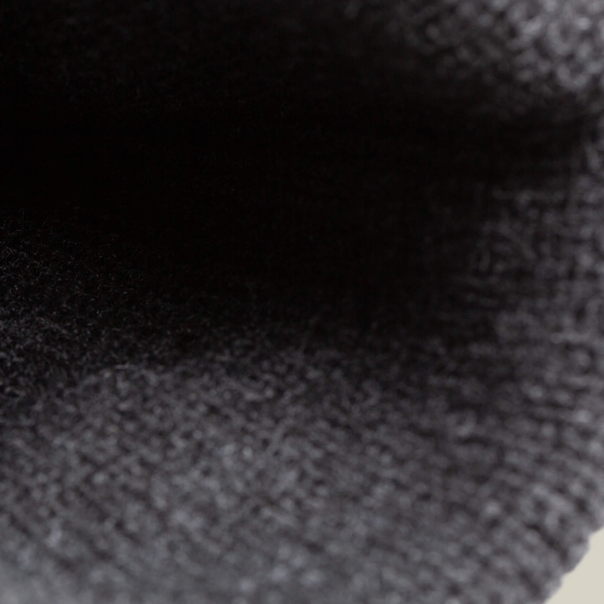 Close-up view inside The Cool Beanie by Goorin Bros., featuring a dark black, ribbed knit fabric with a textured, streetwear-inspired pattern.