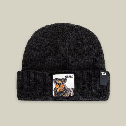 The Guard Beanie by Goorin Bros. is a black knit beanie with a bold Rottweiler patch and "GUARD" on the cuff—your perfect winter accessory.
