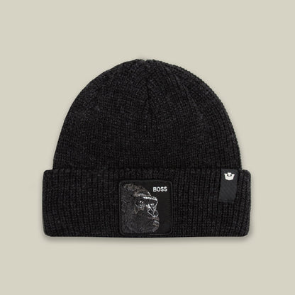 The Boss Beanie by Goorin Bros is a black ribbed knit beanie featuring a woven patch with a gorilla graphic and BOSS text on the front, displayed against a neutral background.