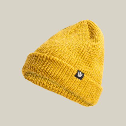 The Goorin Bros. Air to Fakie beanie is a yellow lightweight poly knit hat with a folded brim and a small black patch featuring a white symbol—ideal for all-season wear.