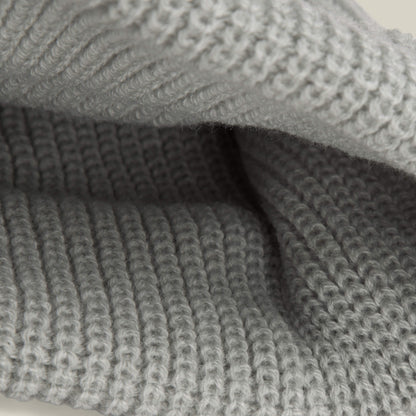 Close-up of the Air to Fakie by Goorin Bros.—light grey poly knit fabric with textured ribbed stitching, ideal for an all-season watchman beanie.