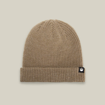 The Goorin Bros. Air to Fakie beanie in tan is an all-season hat, made from lightweight poly knit with a folded brim and a small black and white logo tag on the front.