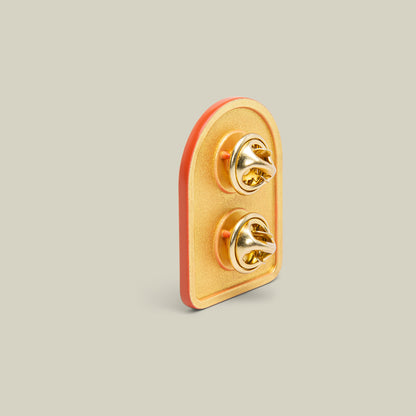 The Early Bird Pin by Goorin Bros. is a gold rooster enamel pin featuring two butterfly clutch fasteners, displayed on a plain light background.