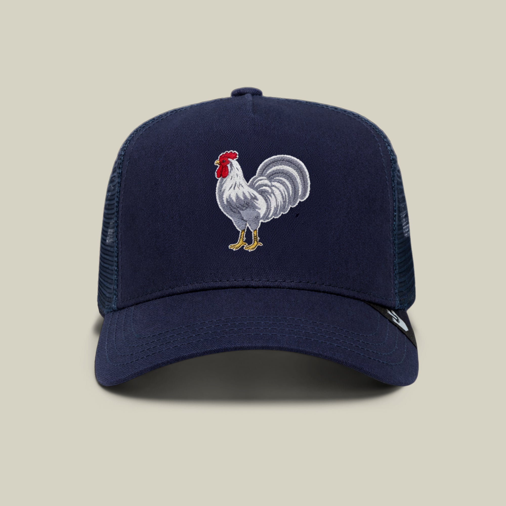 The Goorin Bros. 'Gone Cockfishin'' trucker cap in EDGE NAVY features a white rooster on the front and is shown on a beige background. Buy now for $5 with free shipping—launch day special!.