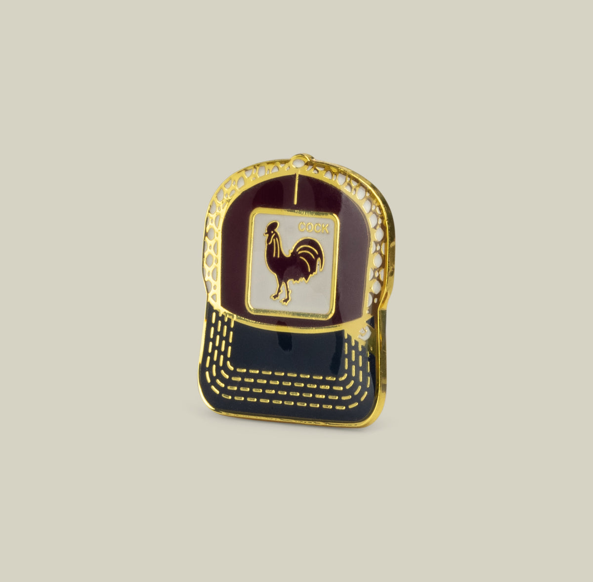 The Goorin Bros. Rooster Trucker Pin in Desire Red features a bold rooster emblem and is displayed on a plain beige background.