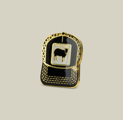 The Black Sheep Trucker Pin by Goorin Bros. in Void features a zinc alloy square patch with a black sheep illustration labeled BLACK SHEEP.