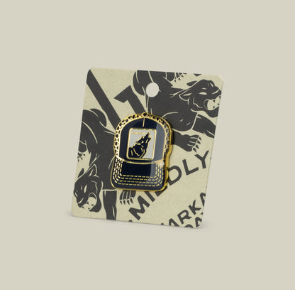 Show off your wolf energy with the gold and black enamel Lone Wolf Trucker Pin by Goorin Bros., featuring a howling wolf on a card with black illustrated wolves.
