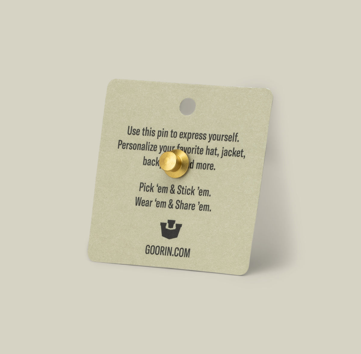 The Lone Wolf Trucker Pin by Goorin Bros. comes on a square card featuring tips for personalizing your hats or jackets and embracing your wolf energy.