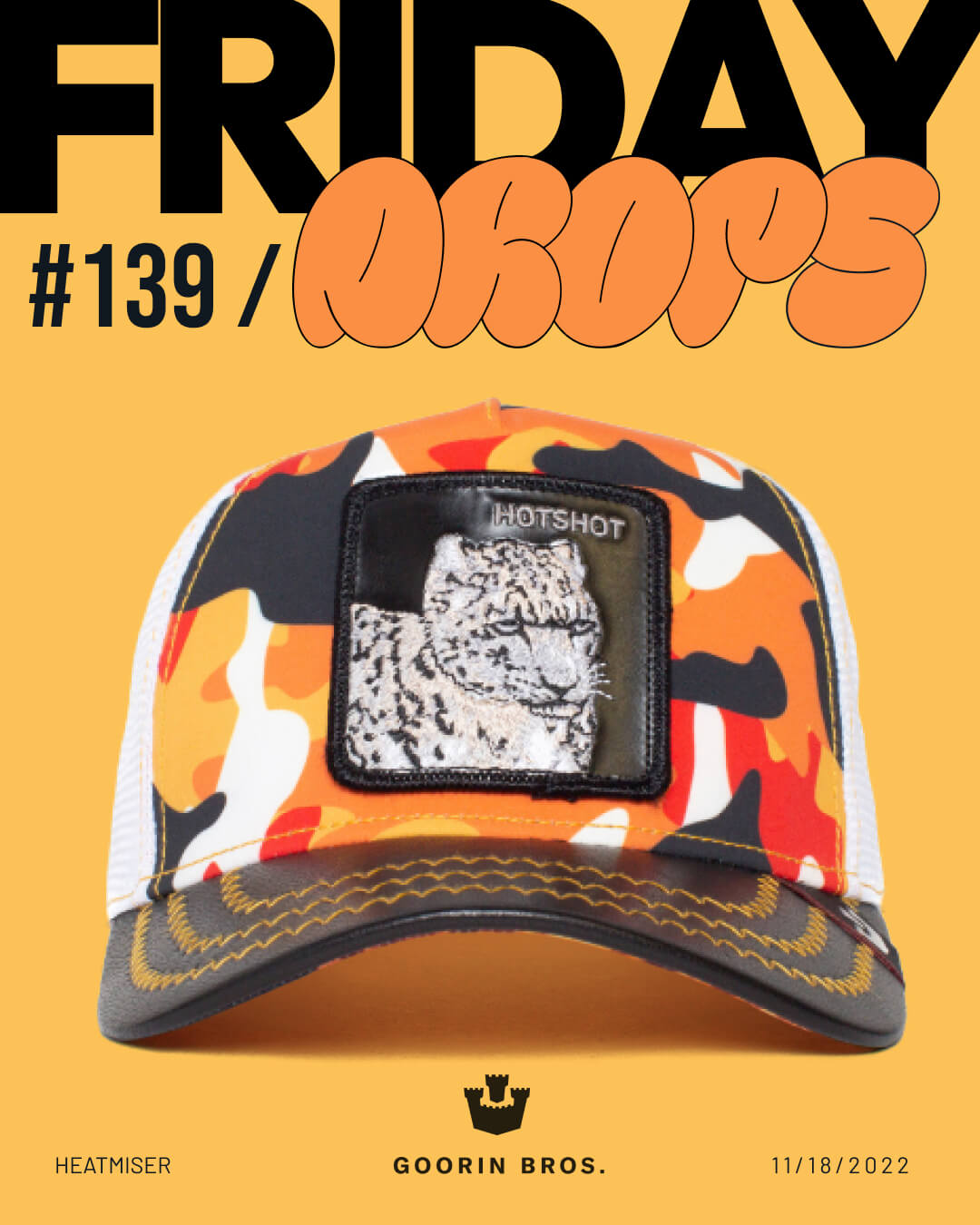 A camouflage trucker hat by Goorin featuring a white tiger patch labeled HOTSHOT stands out against an orange background, showcasing Friday Drops #139 and embodying bold hat designs from Goorin Bros.