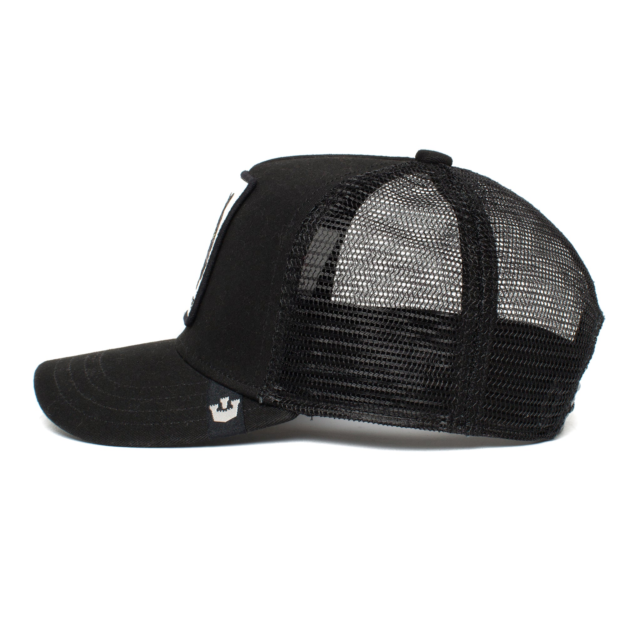 Side view of The Farm’s Little Panther trucker hat for kids, featuring a curved brim, structured front, mesh back for ventilation, and a bold black panther patch.