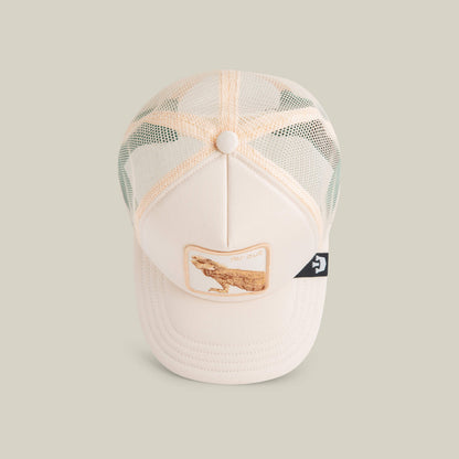 The Goorin Bros. Lil Far Out is a cream-colored mesh kids cap with a breathable design, an embroidered lizard patch on the front, and a small black side tag.