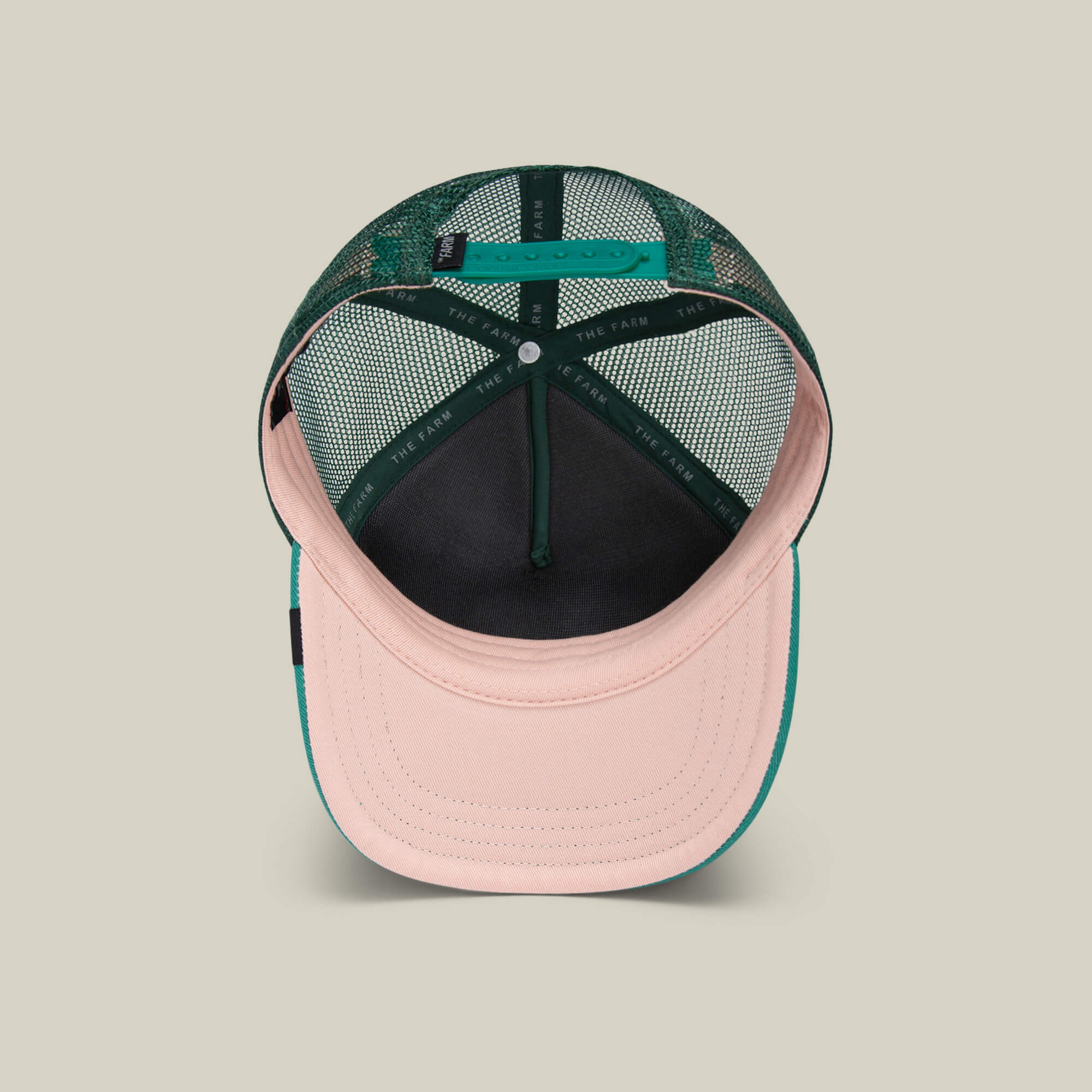 The Lil Boss by Goorin Bros. is a pink and green mesh snapback trucker hat for kids, featuring an adjustable closure, contrasting brim, and breathable back—a playful upgrade to the classic gorilla cap.