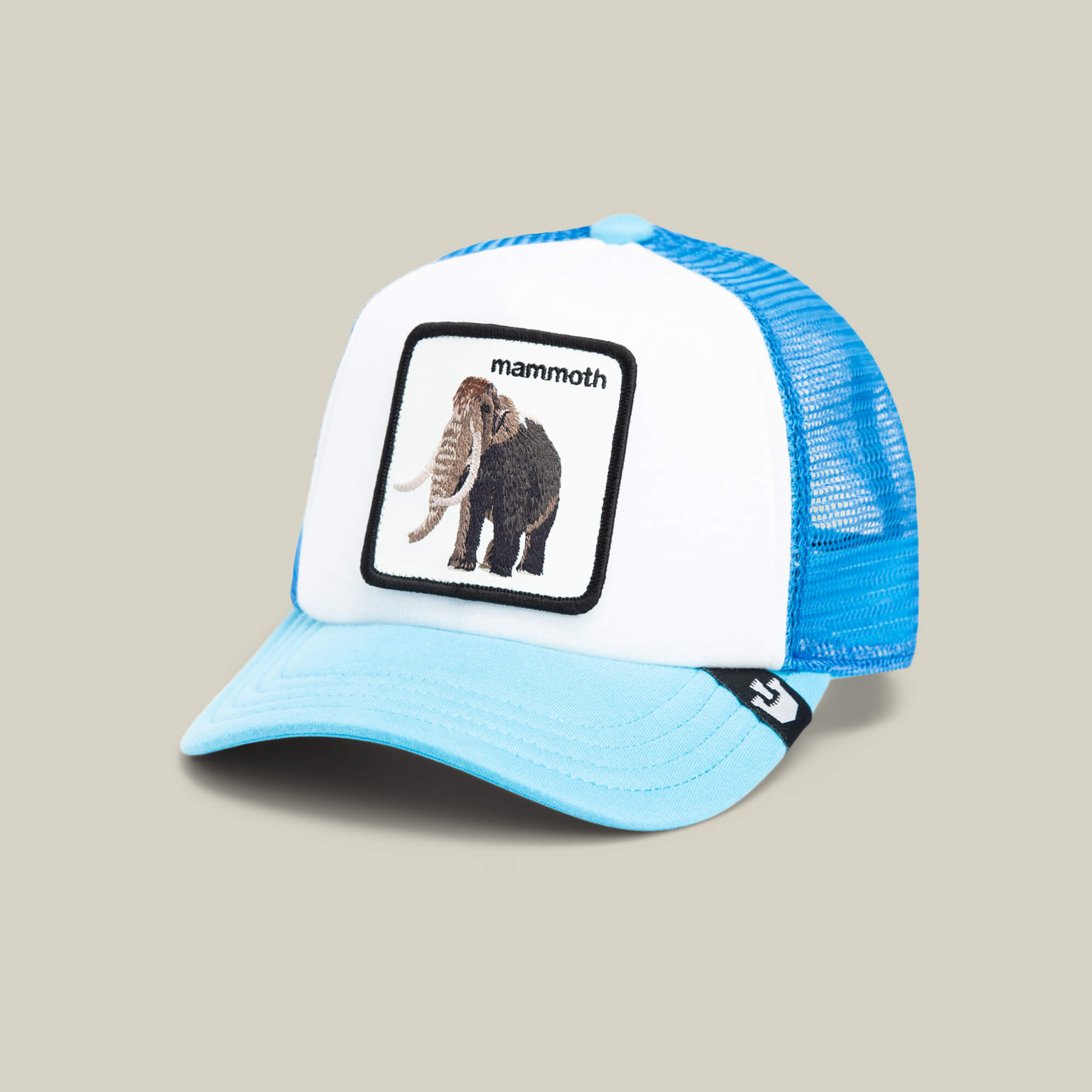 The Goorin Bros. Mammoth Kiddo is a light blue and white kids baseball cap with a blue mesh back, embroidered woolly mammoth patch, and "mammoth" on the front—perfect for your little explorer’s next adventure.